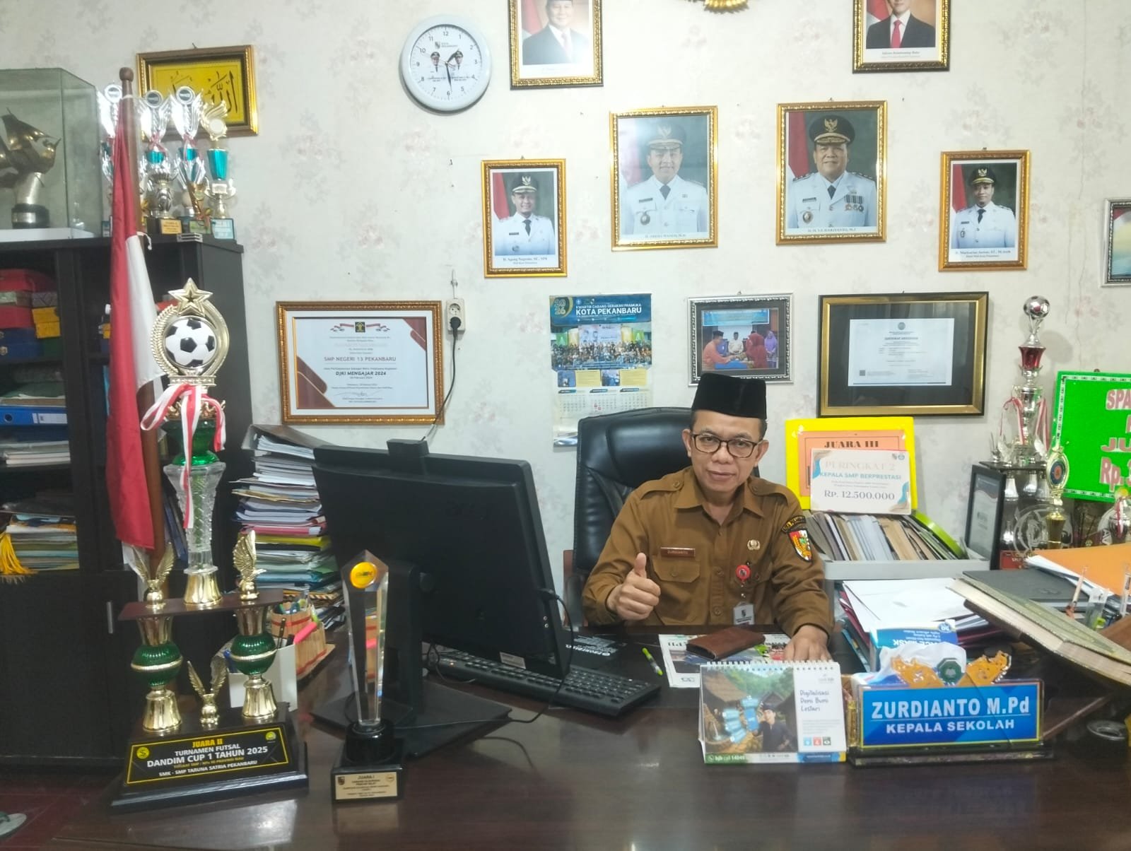  | Kepercayaan Yang MenginspirasiI: KEPSEK SMPN 13 Pekanbaru Dalam Presentasi GMTGT Tiga Negara